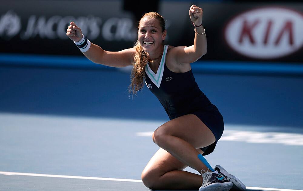 Dominika Cibulkova of Slovakia celebrates after defeating Agnieszka Radwanska of Poland during their semifinal at the Australian Open tennis championship in Melbourne, Australia.