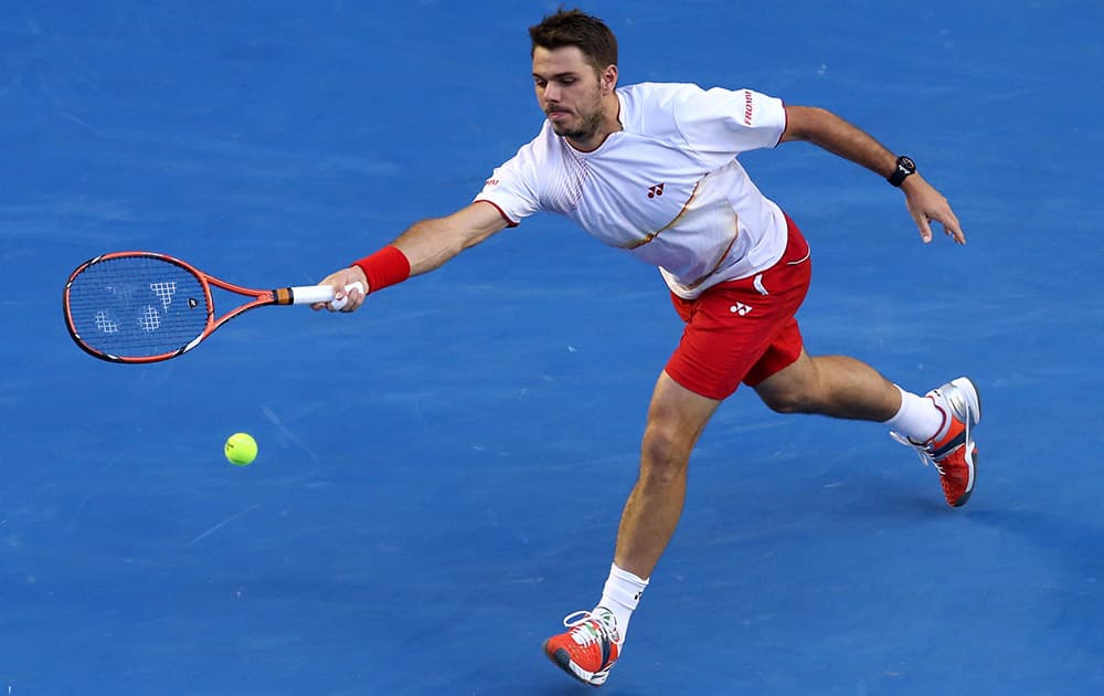 Stanislas Wawrinka of Switzerland reaches for a shot to Tomas Berdych of the Czech Republic during their semifinal at the Australian Open tennis championship in Melbourne, Australia.