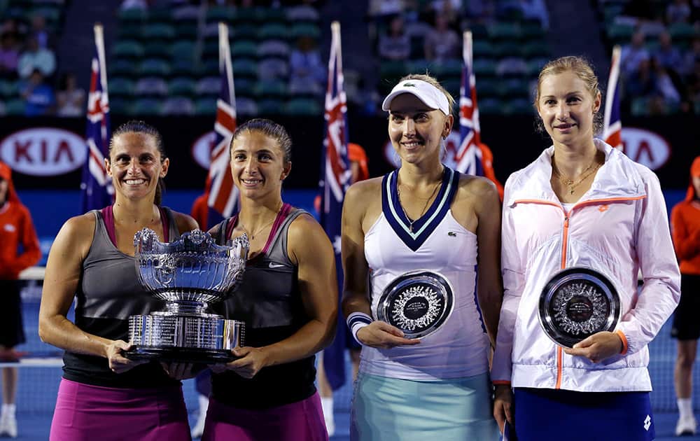 Italy's Sara Errani, left, and Roberta Vinci, second left, hold the championship trophy along with second placed Russia's Ekaterina Makarova, far right, and Elena Vesnina, second right, after their women's doubles final at the Australian Open tennis championship in Melbourne.