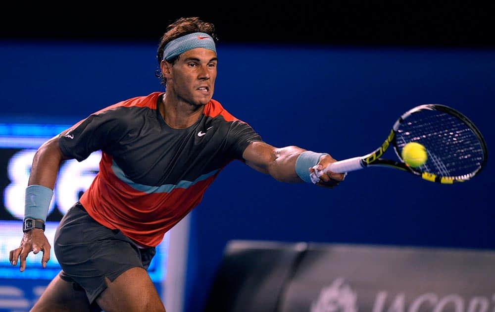 Rafael Nadal of Spain makes a forehand return to Roger Federer of Switzerland during their semifinal at the Australian Open tennis championship in Melbourne.