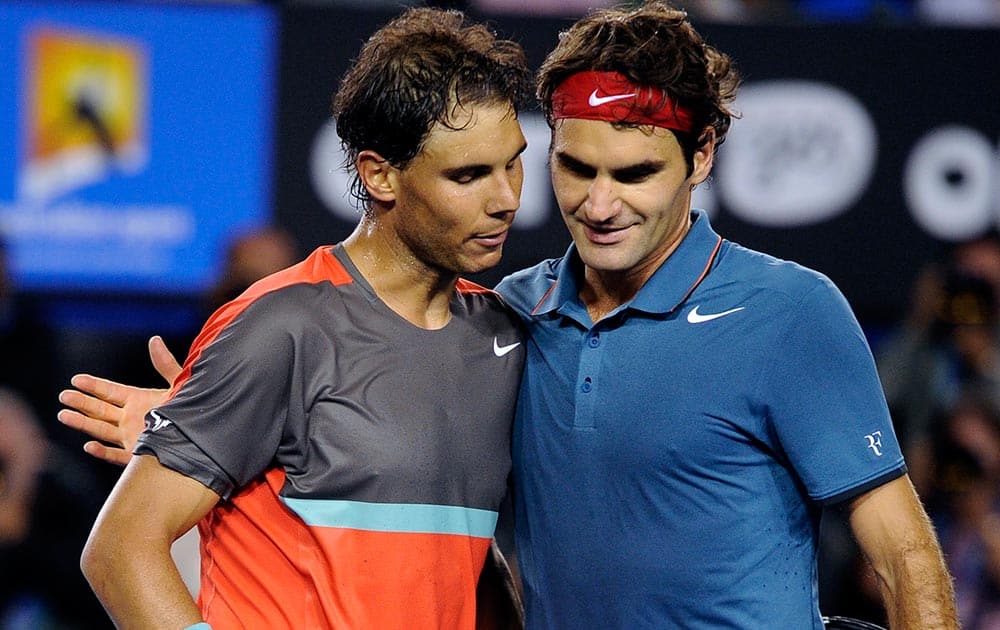 Rafael Nadal of Spain, left, is congratulated by Roger Federer of Switzerland at the net after Nadal won their semifinal final at the Australian Open tennis championship in Melbourne.
