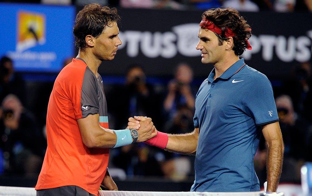 Rafael Nadal of Spain, left, is congratulated by Roger Federer of Switzerland at the net after Nadal won their semifinal final at the Australian Open tennis championship in Melbourne.