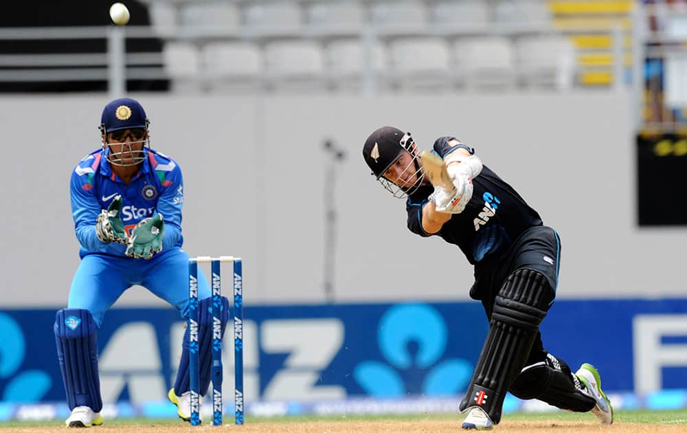 New Zealand's Kane Williamson bats in front of India’s MS Dhoni in the third one-day International cricket match at Eden Park in Auckland, New Zealand