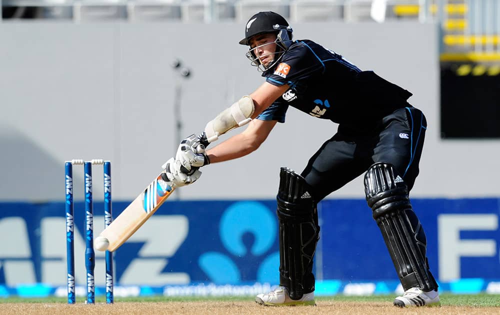 New Zealand's Tim Southee reaches to play a shot against India in the third one-day International cricket match at Eden Park in Auckland, New Zealand