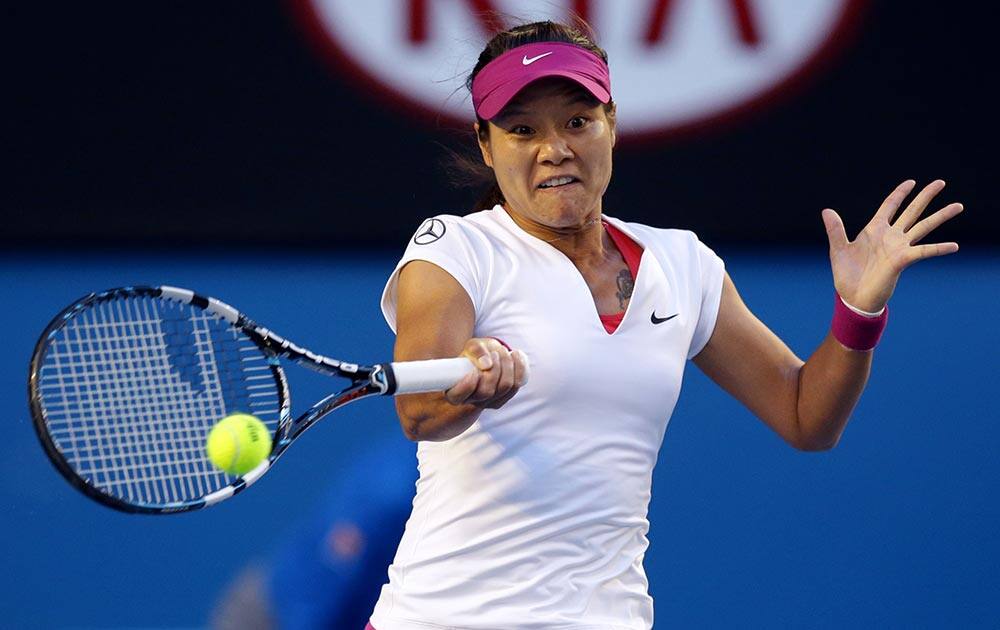 Li Na of China makes a forehand return to Dominika Cibulkova of Slovakia during their women's singles final at the Australian Open tennis championship in Melbourne, Australia.