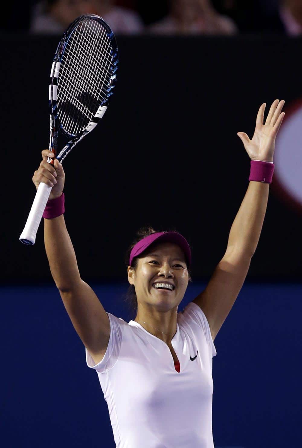 Li Na of China celebrates after defeating Dominika Cibulkova of Slovakia during their women's singles final at the Australian Open tennis championship in Melbourne, Australia.