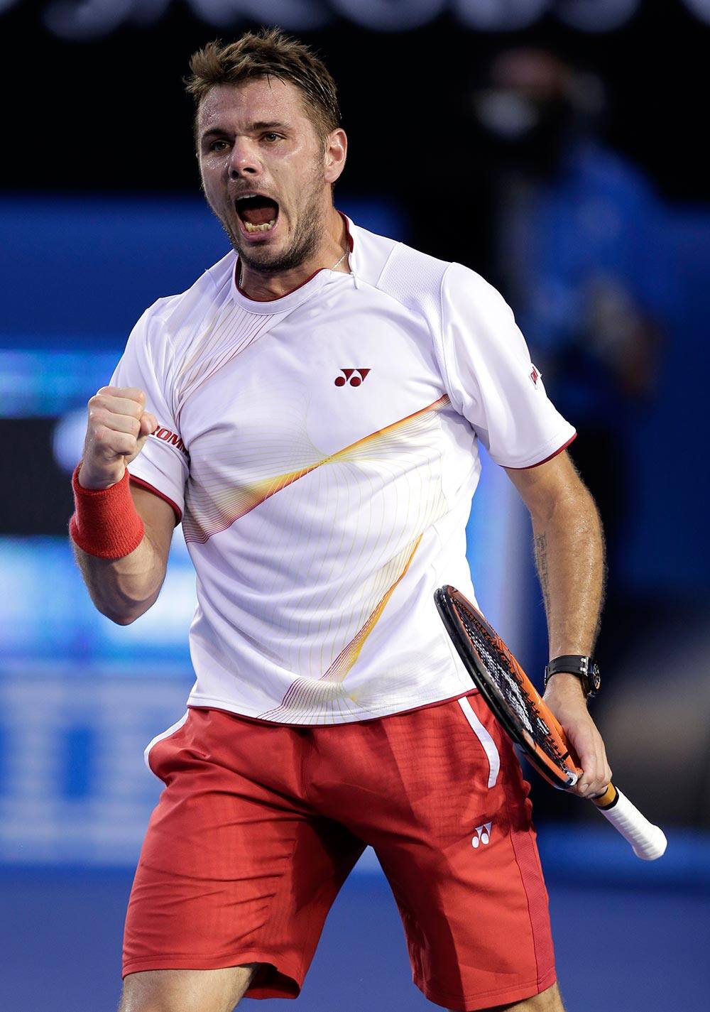 Stanislas Wawrinka of Switzerland celebrates a point won against Rafael Nadal of Spain during the men's singles final at the Australian Open tennis championship in Melbourne.