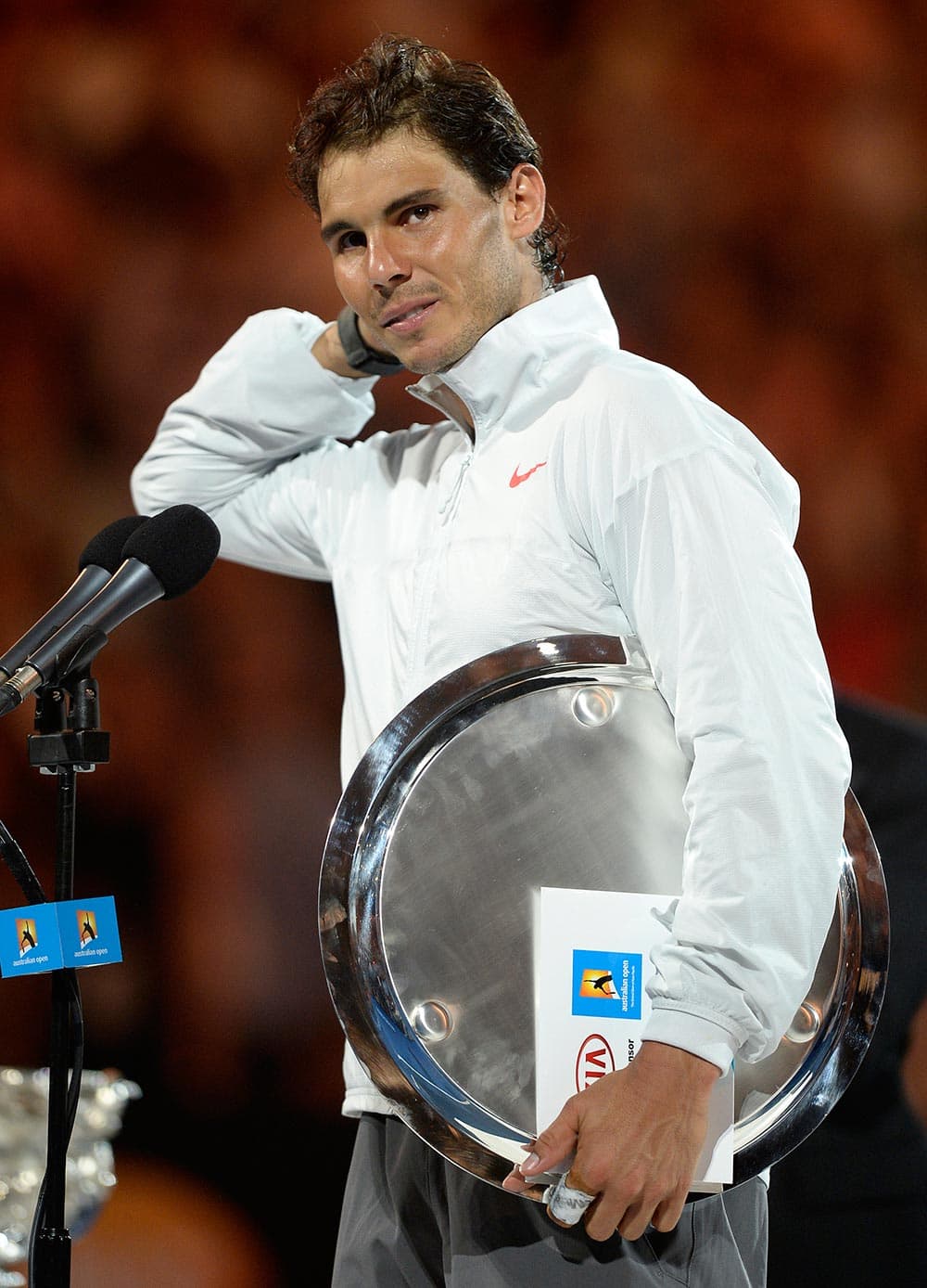 Rafael Nadal of Spain speaks during the trophy presentation, after his loss to Stanislas Wawrinka of Switzerland in the men's singles final at the Australian Open tennis championship in Melbourne.
