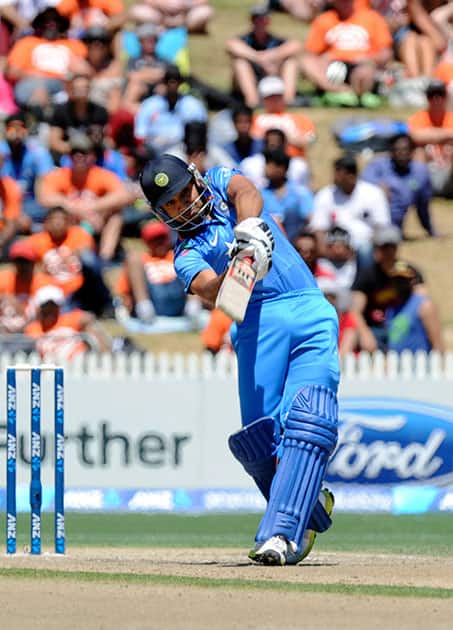 India’s Rohit Sharma hits a six against New Zealand in the fourth one-day international cricket match at Seddon Park in Auckland.