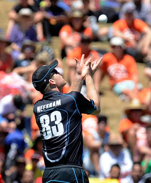 New Zealand’s James Neesham prepares to take the catch to dismiss India’s Virat Kohli for 2 in the fourth one-day international cricket match at Seddon Park in Auckland.
