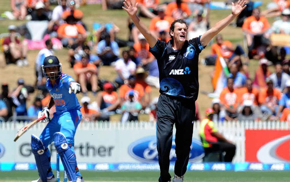 New Zealand’s Kyle Mills, right, appeals unsuccessfully for the wicket of India’s Virat Kohli in the fourth one-day international cricket match at Seddon Park in Auckland.