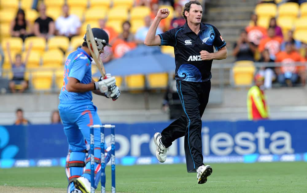 New Zealand’s Kyle Mills celebrates after India’s Rohit Sharma was caught behind by Ross Taylor for 4 in their fifth one day international cricket match at Westpac Stadium in Wellington, New Zealand.
