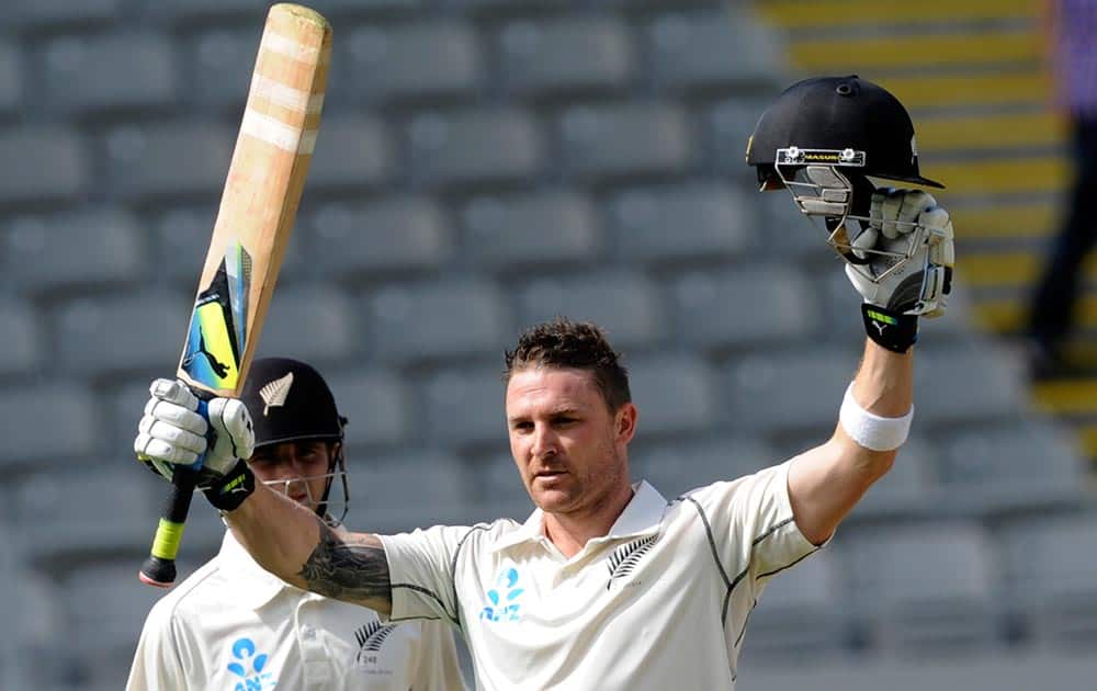 New Zealand’s Brendon McCullum celebrates his century against India on the first day of the first cricket test at Eden Park in Auckland, New Zealand.