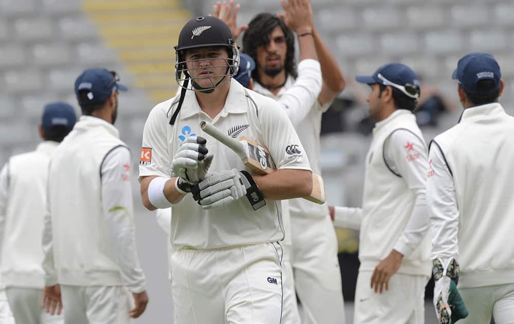 New Zealand’s Corey Anderson walks out for 77 trapped lbw by India’s Ishant Sharma on the second day of the first cricket test at Eden Park in Auckland, New Zealand.