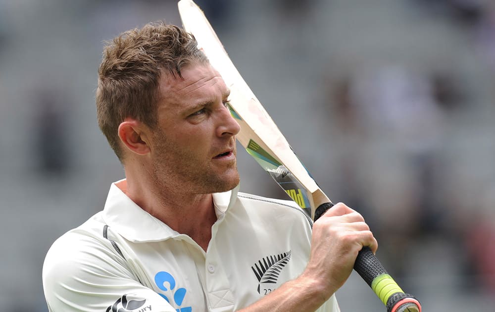 New Zealand’s Brendon McCullum salutes the crowd after being dismissed, caught on the boundary by India’s Ravindra Jadeja for 224 on the second day of the first cricket test at Eden Park in Auckland, New Zealand.
