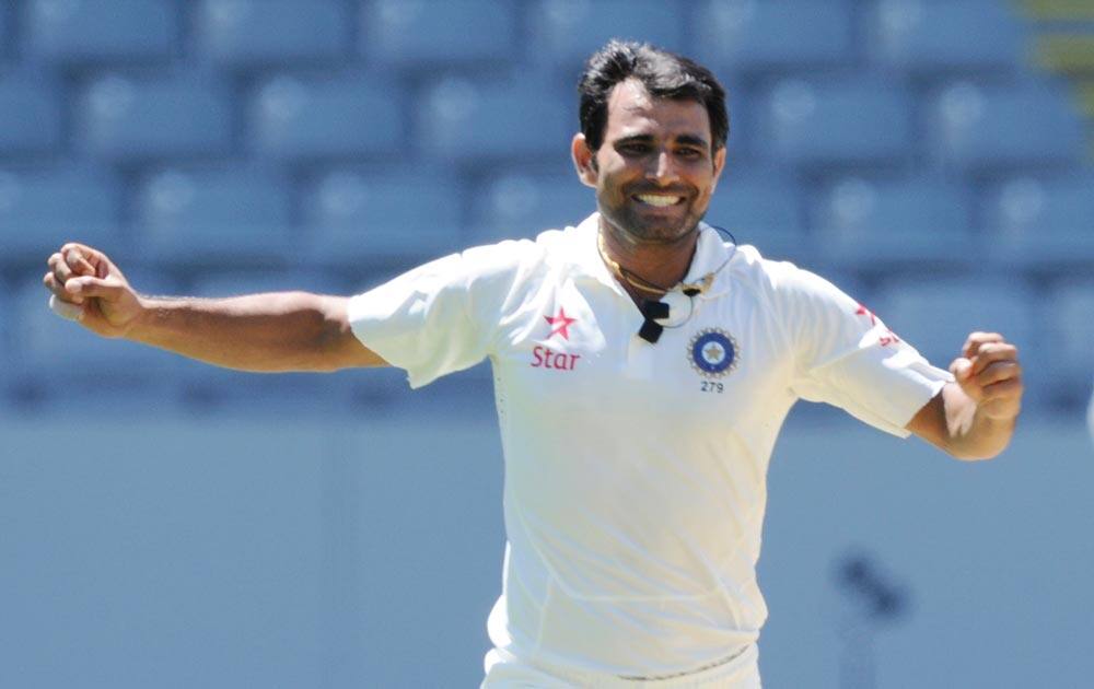 Mohammed Shami celebrates bowling out New Zealand’s Corey Anderson for 2 on the 3rd day of the 1st cricket test at Eden Park in Auckland.