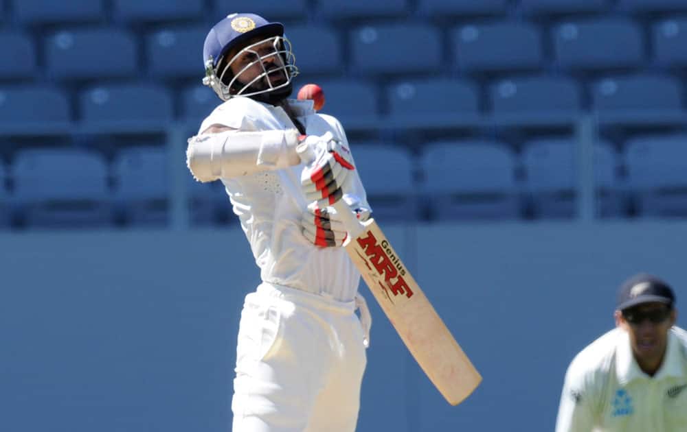 India’s Shikar Dhawan plays a high ball to be caught out for 115 by New Zealand’s wicket keeper off the bowling of Neil Wagner BJ Watling on the fourth day of the first cricket test at Eden Park, Auckland, New Zealand.