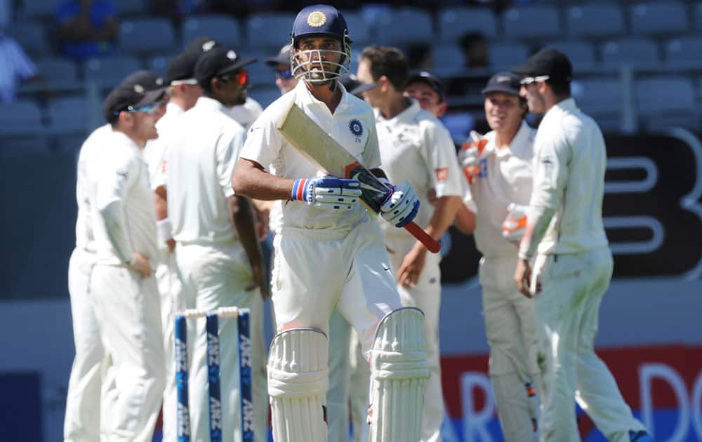 India’s Ajinkya Rahane walks out for 18, lbw to New Zealand’s Trent Boult on the fourth day of the first cricket test at Eden Park in Auckland, New Zealand.