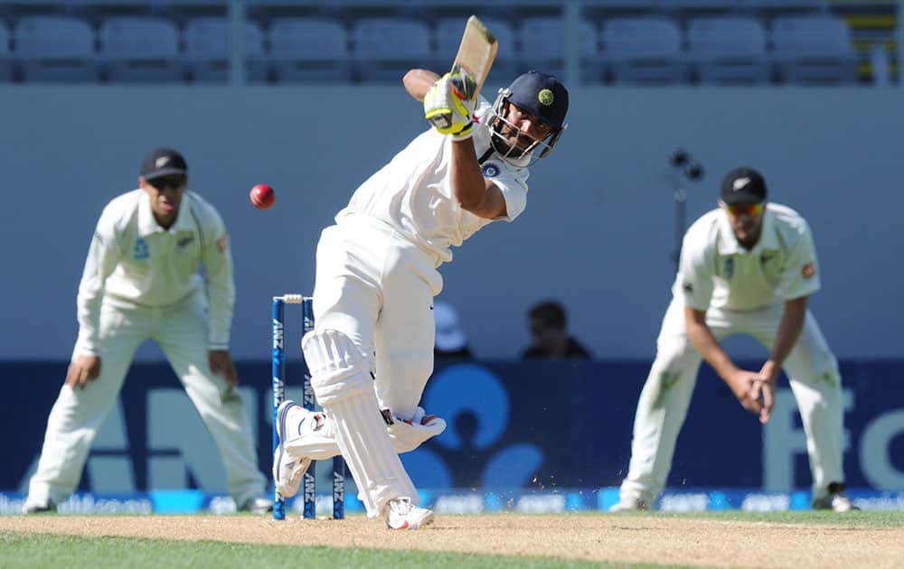 India’s Ravindra Jadeja hits out to be caught by New Zealand’s Ish Sodhi for 26 on the fourth day of the first cricket test at Eden Park in Auckland, New Zealand.