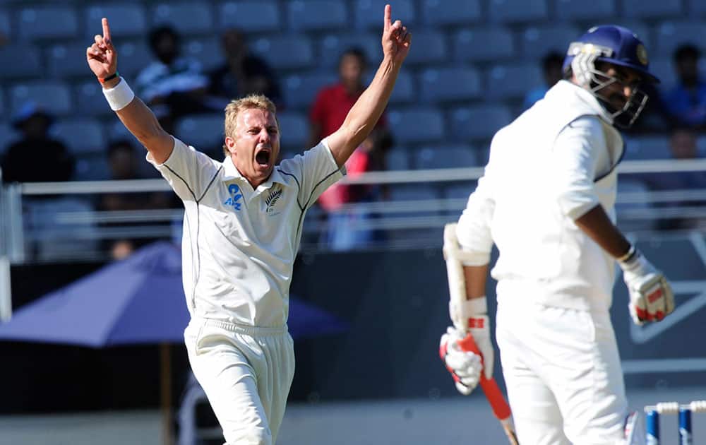 New Zealand’s Neil Wagner celebrates the dismissal off his bowling of India’s Zaheer Khan for 26 on the fourth day of the first cricket test at Eden Park in Auckland, New Zealand.