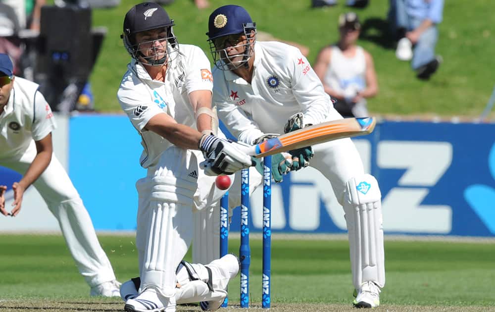 New Zealand’s Tim Southee attempts against sweep in front of India’s wicket keeper MS Dhoni on the 1st day of the 2nd cricket test at Basin Reserve in Wellington, New Zealand.