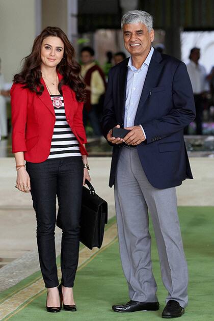 Preity Zinta, Co-owner of Kings XI Punjab with BCCI Secretary, Sanjay Patel after completing the IPL Auction 2014 in Bengaluru.