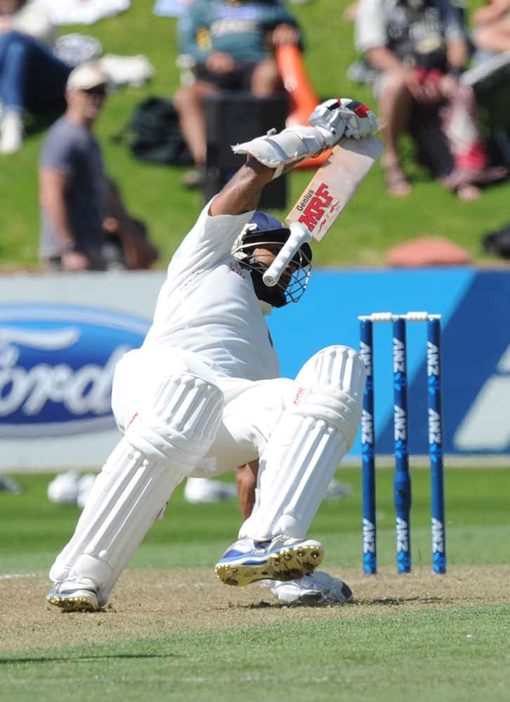India’s Shikar Dhawan stumbles as he attempts to return to his crease against New Zealand on the second day of the second cricket test in Wellington, New Zealand.