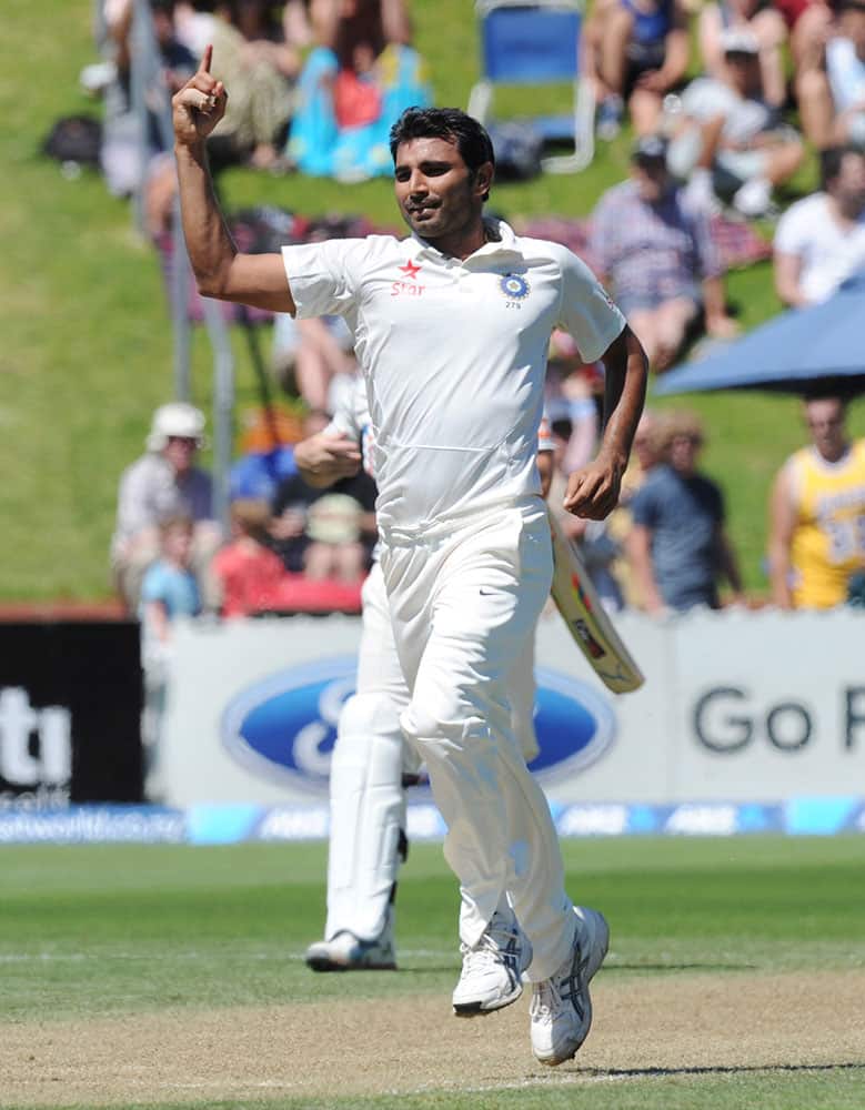 India’s Mohammed Shami takes the wicket of New Zealand’s Tom Latham for 29 on the third day of the second cricket test at Basin Reserve in Wellington, New Zealand.