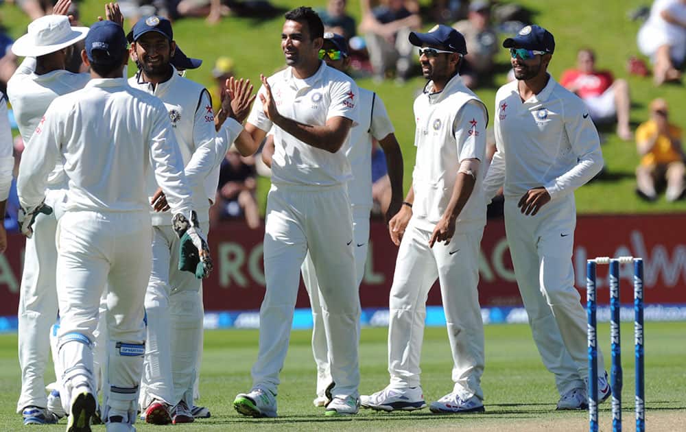India’s Zaheer Khan, center, celebrates with teammates after dismissing New Zealand’s Kane Williamson for 7 on the third day of the second cricket test at Basin Reserve in Wellington, New Zealand.