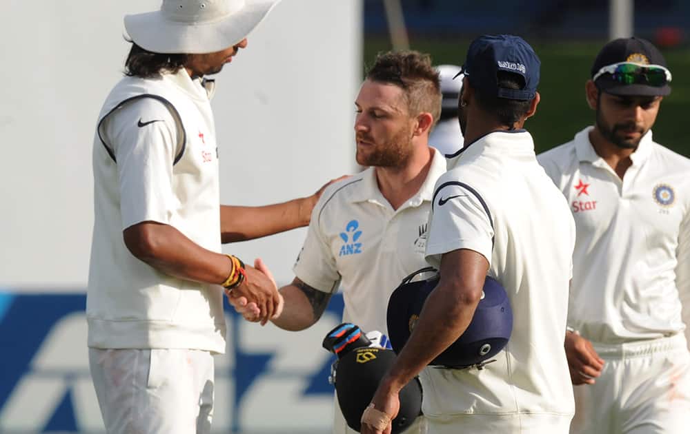 India’s Ishant Sharma shakes hands with New Zealand’s Brendon McCullum at the end of play as he reached his highest score of 281 on the fourth day of their second cricket test mat at Basin Reserve in Wellington, New Zealand.
