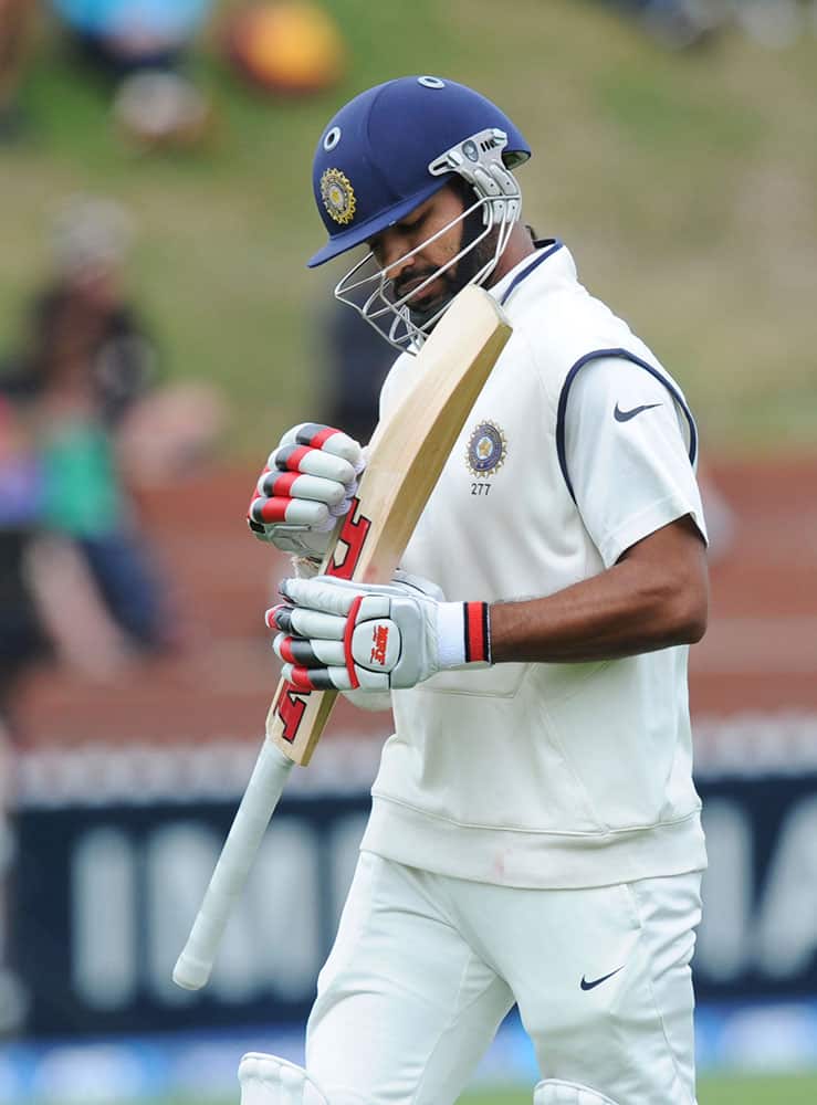 India’s Shikar Dhawan walks, out lbw for 2 to New Zealand’s Trent Boult on the final day of the second test at the Basin Reserve in Wellington, New Zealand.