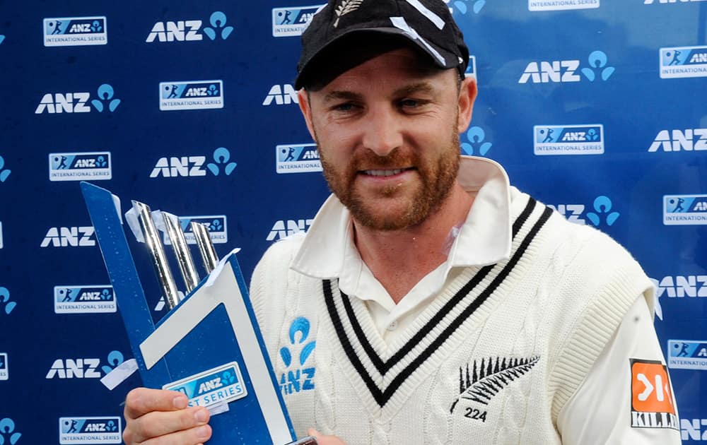 New Zealand’s captain Brendon McCullum poses with the trophy after his teams series win over India on the final day of the second test at the Basin Reserve in Wellington, New Zealand.
