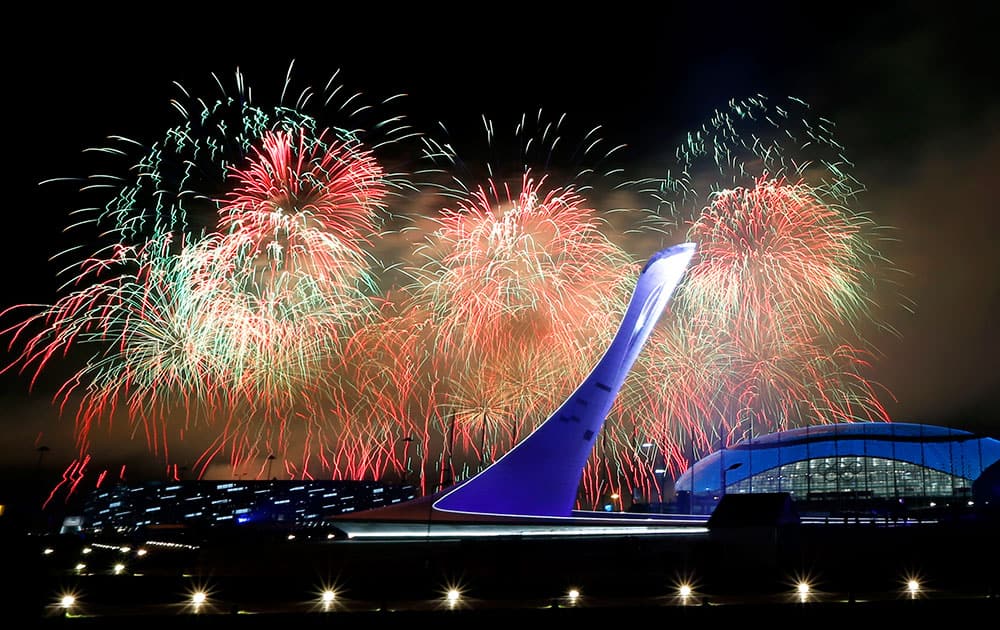 Fireworks burst over the Olympic cauldron during the closing ceremony of the 2014 Winter Olympics.