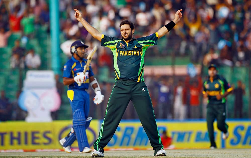 Pakistan's Shahid Afridi celebrates the wicket of Sri Lanka’s Mahela Jayawardene during the opening match of the Asia Cup one-day international cricket tournament between them in Fatullah, near Dhaka, Bangladesh.