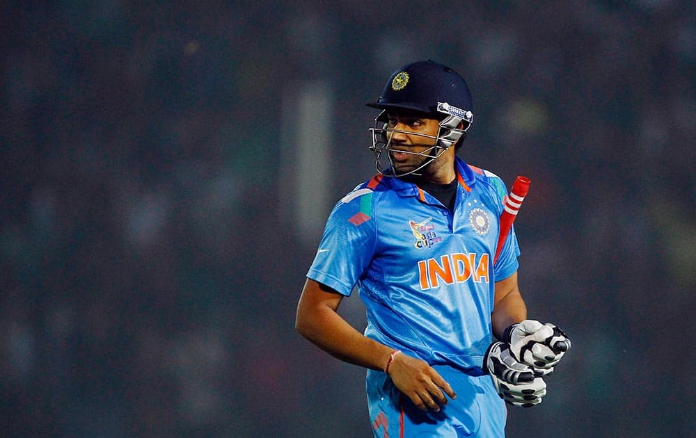 India’s Rohit Sharma looks back as he walks back to the pavilion after his dismissal by Bangladesh’s Ziaur Rahman during the Asia Cup one-day international cricket tournament between them in Fatullah, near Dhaka, Bangladesh.
