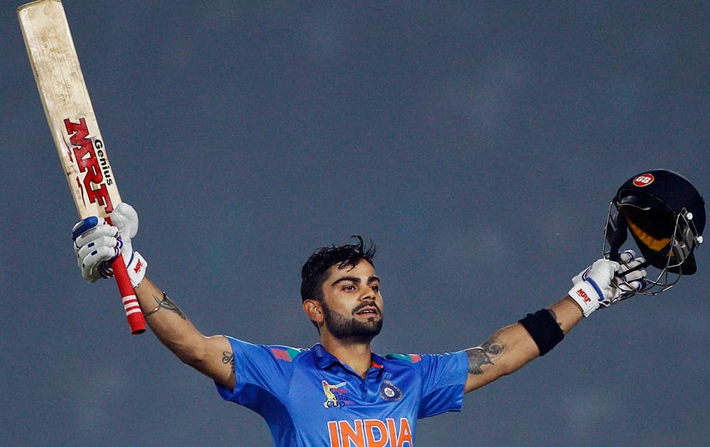 India’s Virat Kohli celebrates scoring a century during the Asia Cup one-day international cricket tournament against Bangladesh in Fatullah, near Dhaka, Bangladesh.