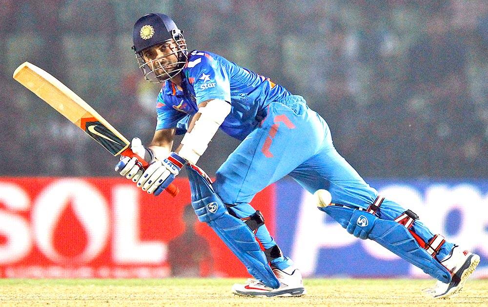 India’s Ajinkya Rahane plays a shot during the Asia Cup one-day international cricket tournament against Bangladesh in Fatullah, near Dhaka, Bangladesh.