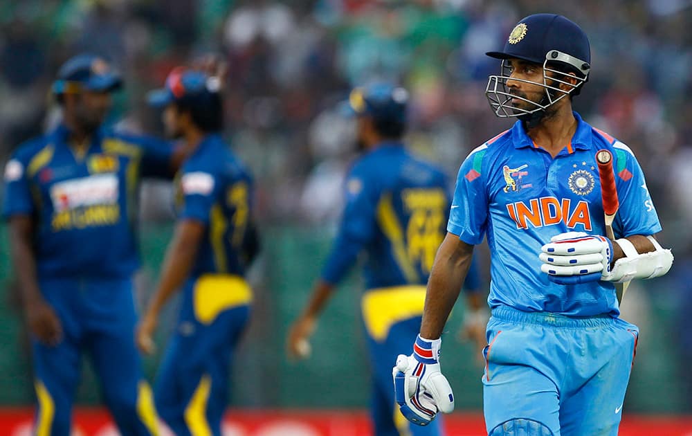 India’s Ajinkya Rahane walks back after his dismissal during the Asia Cup one-day international cricket tournament against Sri Lanka in Fatullah, near Dhaka, Bangladesh.