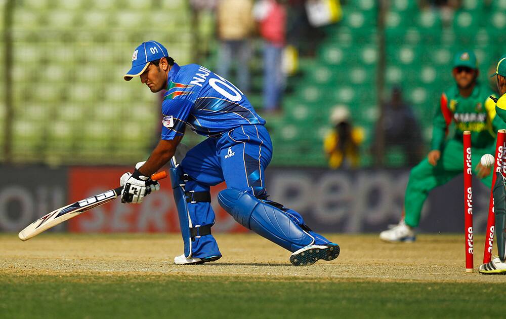 Afghanistan’s Najibullah Zadran is bowled out by Bangladesh’s Arafat Sunny during during the Asia Cup one-day international cricket tournament between them in Fatullah, near Dhaka, Bangladesh.