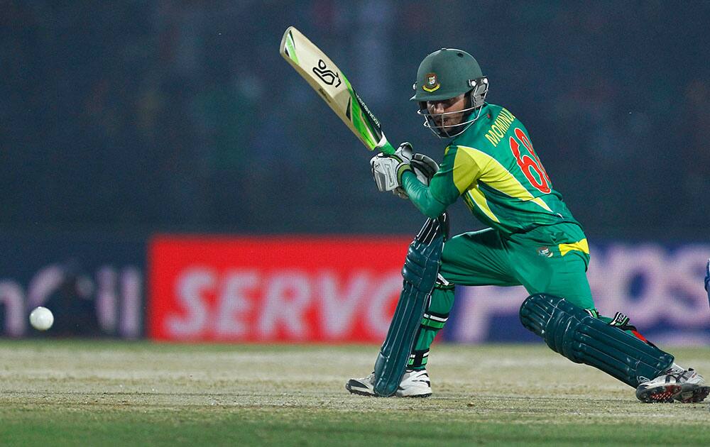 Bangladesh’s Mominul Haque plays a shot during the Asia Cup one-day international cricket tournament against Afghanistan in Fatullah, near Dhaka, Bangladesh.