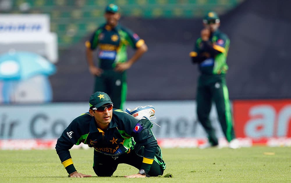 Pakistan’s Misbah-ul-Haq dives to save the ball during the Asia Cup one-day international cricket tournament against India in Dhaka, Bangladesh.
