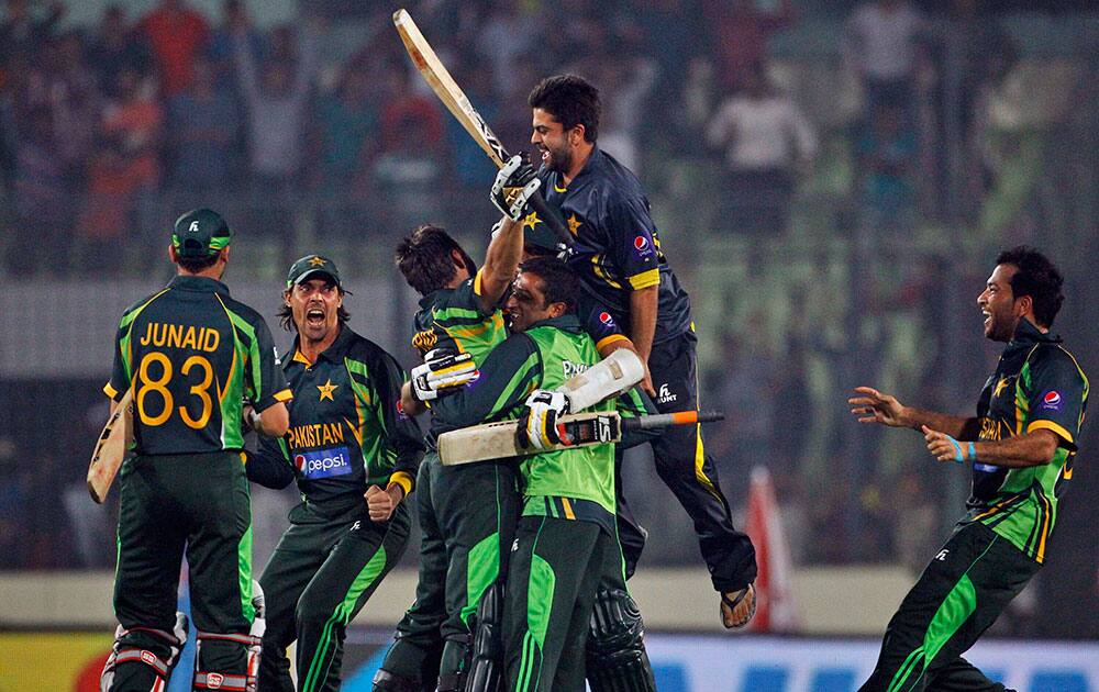 Pakistan’s team celebrates after winning the Asia Cup one-day international cricket tournament against India in Dhaka, Bangladesh.