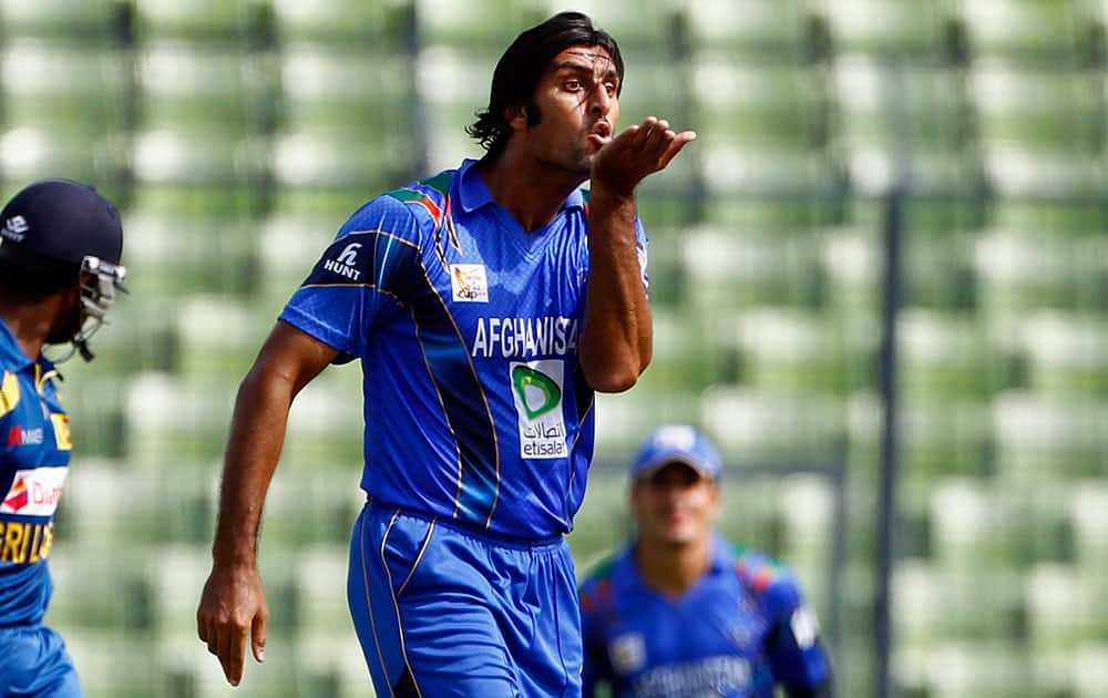 Afghanistan’s Shapoor Zadran celebrates after taking the wicket of Sri Lanka’s Lahiru Thirimanne during the Asia Cup one-day international cricket tournament between them in Dhaka.