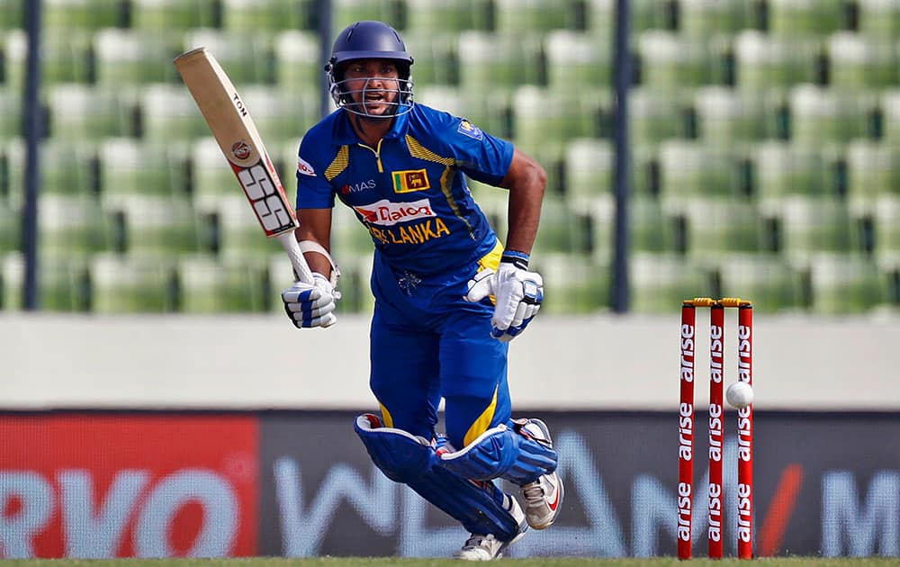 Sri Lanka’s Kumar Sangakkara plays a shot during the Asia Cup one-day international cricket tournament against Afghanistan in Dhaka.