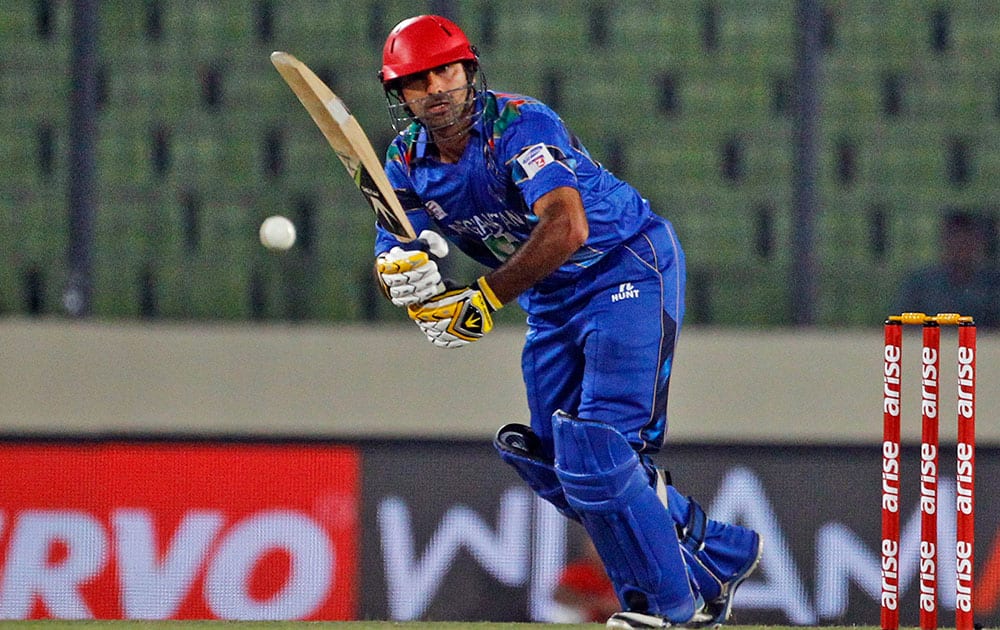 Afghanistan’s Asghar Stanikzai plays a shot during the Asia Cup one-day international cricket tournament between them and Sri Lanka in Dhaka, Bangladesh.