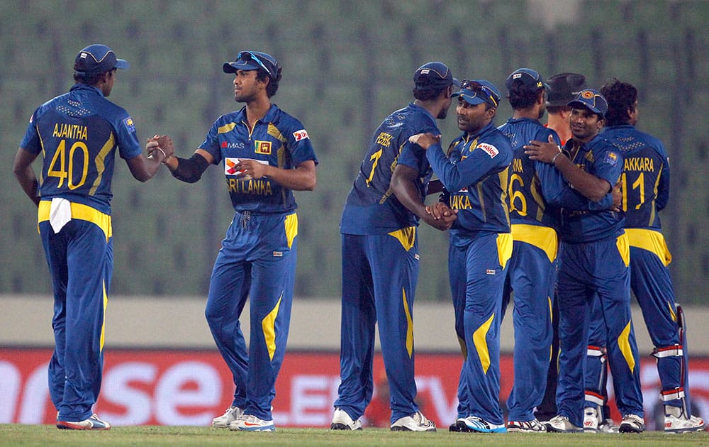 Sri Lankan players celebrate their win over Afghanistan during the Asia Cup one-day international cricket match in Dhaka, Bangladesh.
