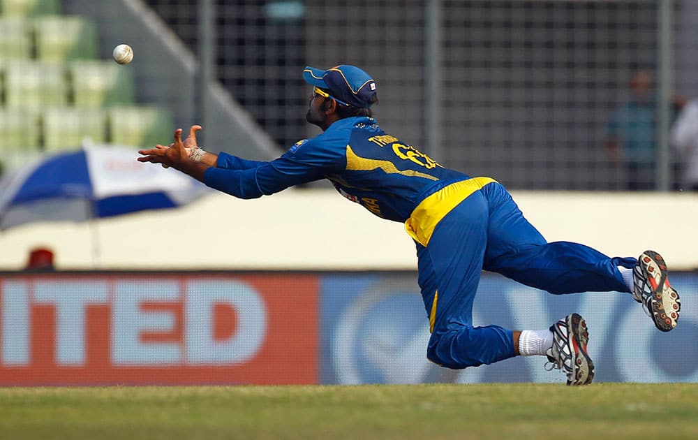Sri Lanka’s Lahiru Thirimanne cups his hands to catch the ball resulting in the dismissal of Bangladesh’s Anamul Haque during the Asia Cup one-day international cricket tournament in Dhaka.