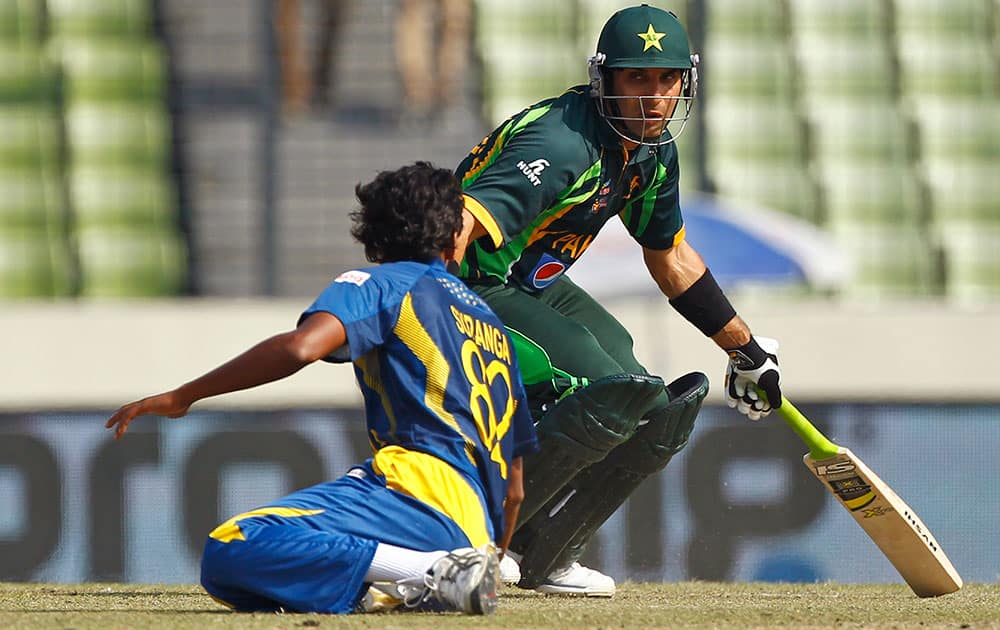 Pakistan’s captain Misbah-ul-Haq, right, collides with Sri Lanka’s Suranga Lakmal in an attempt to make a run during their Asia Cup final cricket match in Dhaka, Bangladesh.