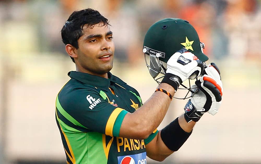 Pakistan’s Umar Akmal celebrates after scoring fifty runs against Sri Lanka during their Asia Cup final cricket match in Dhaka, Bangladesh.
