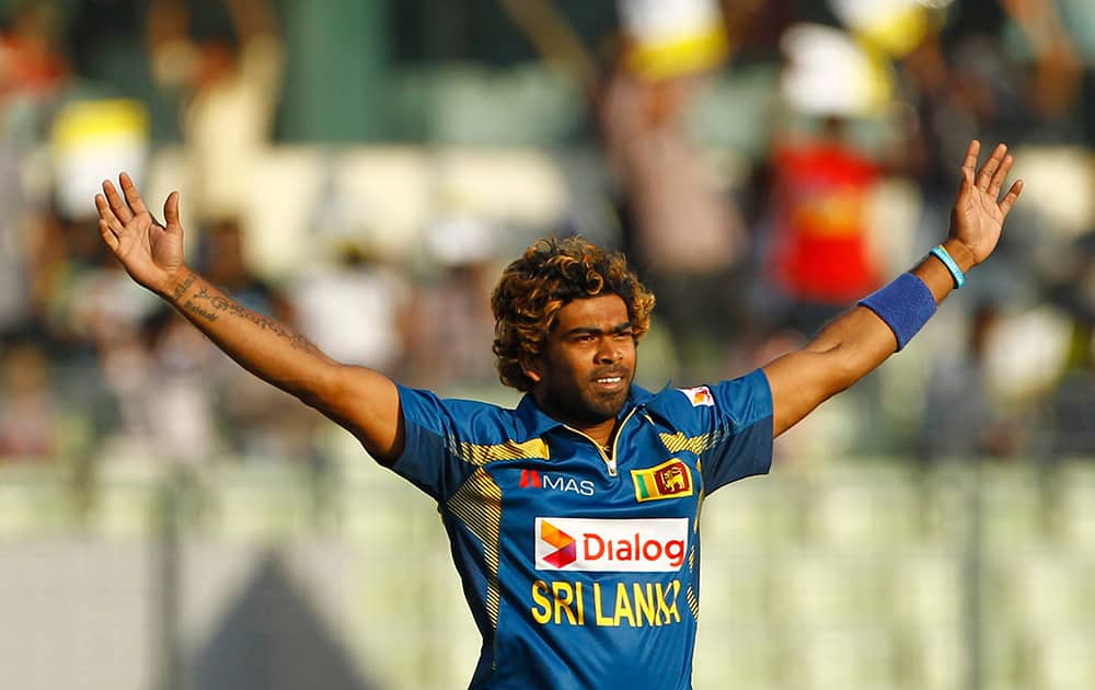 Sri Lanka's Lasith Malinga celebrates taking the wicket of Pakistan’s captain Misbah-ul-Haq during their Asia Cup final cricket match in Dhaka, Bangladesh.